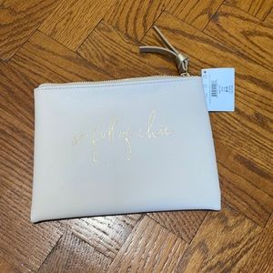 Saks fifth avenue pale pink pouch “so full of chic” NWT